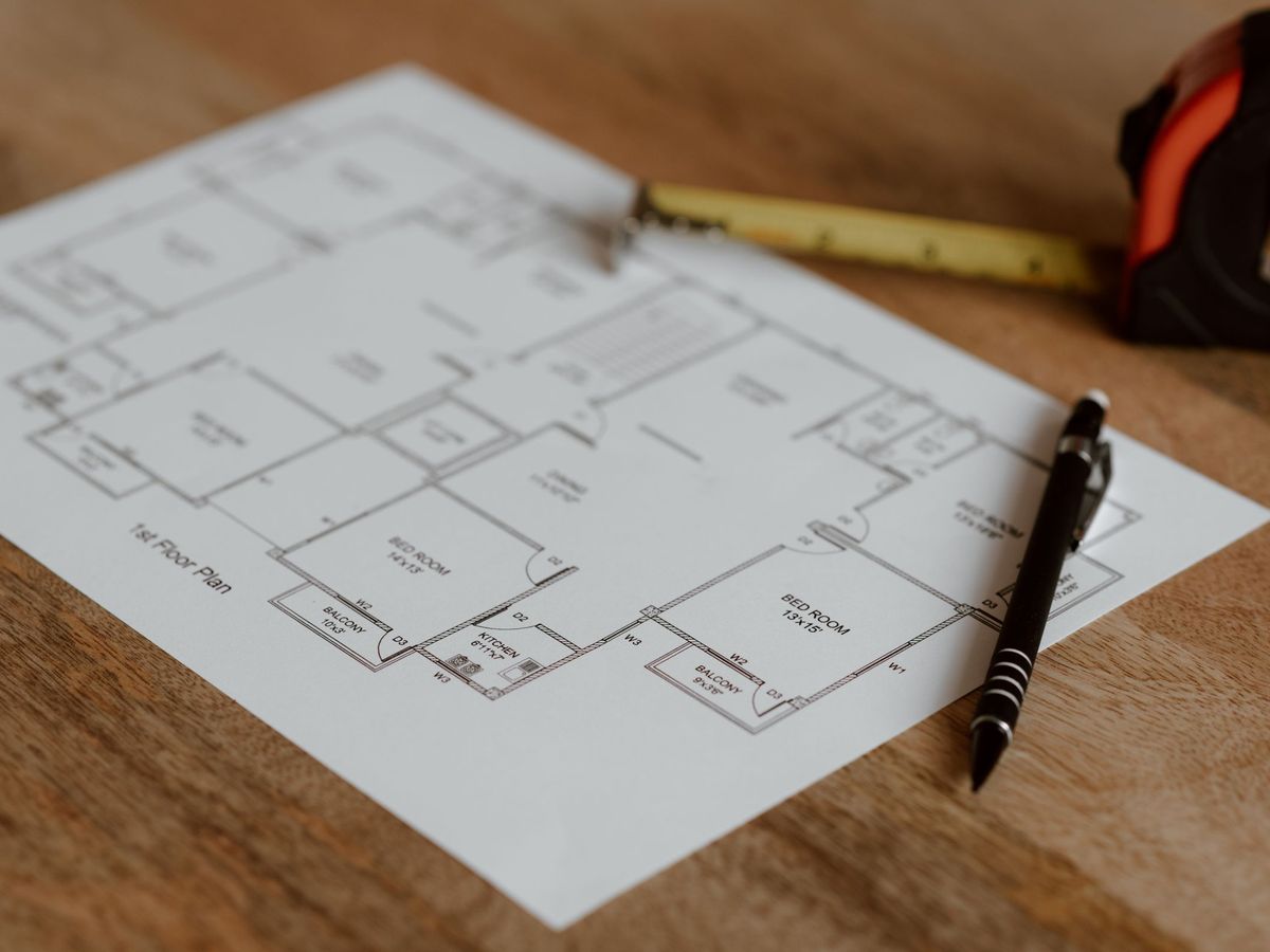Floor plan and tape measure on a table